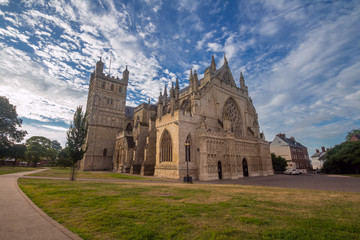 Cathedral in Exeter. Early morning. Low sunlight. Blue sky with cirrus clouds. Nobody. Devon. UK