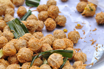 Fried taro ball in aluminium pot at Thailand market.