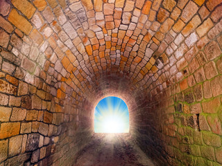 Light at end of the tunnel. Way to freedom or to heaven. Opened door from prison or grave. Hope metaphor. 
