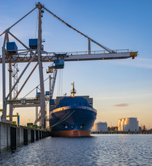 Fototapeta na wymiar unloading a container ship in the sea port in Szczecin