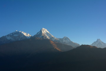 Naklejka na ściany i meble Sunrise view over Annapurna mountains, in the Himalayas mountain range from Poon Hill
