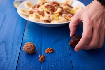 flakes with dried fruit, granola on the plate