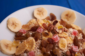 flakes with dried fruit, granola on the plate