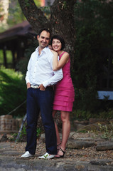 Fototapeta premium smiling man and woman hugging on the nature