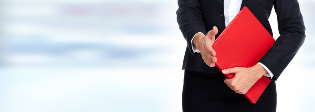 Hands with red folder