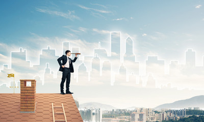 Engineer man standing on roof and looking in spyglass. Mixed med