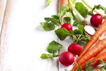 Spring vegetables on wooden background with copy space. 