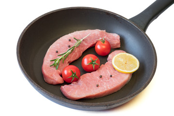 Raw pork on a pan isolated on white background.