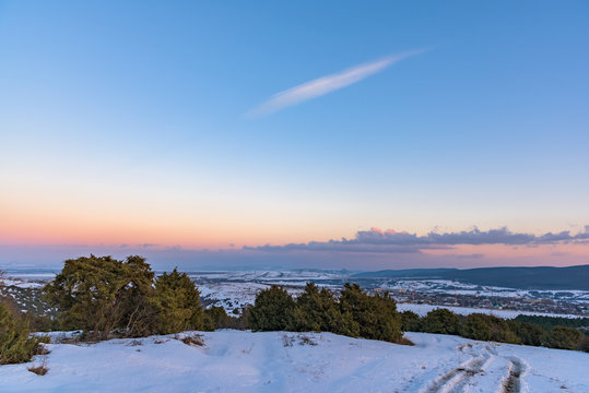 Beautiful view of winter sunset and the city below with road. Russia, Stary Krym.