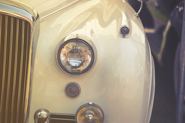 close up on old vintage car ,front light