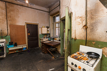 Dirty kitchen is in the temporary apartment for living (existence) refugees