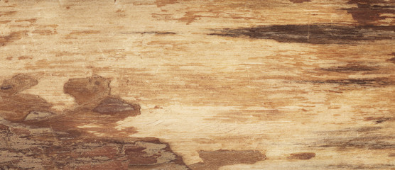 Brown scratched wood texture with natural pattern. Wooden background 