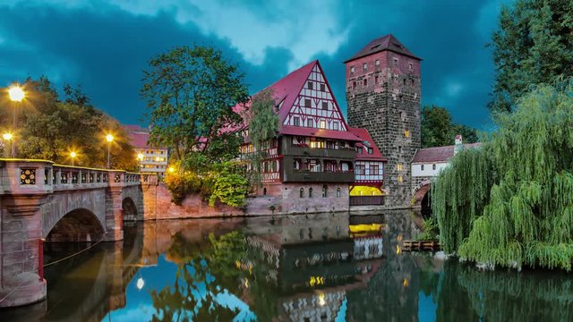 Maxbrucke bridge and Henkerturm tower - part of western medieval fortifications of Nuremberg (static image with animated sky and water)
