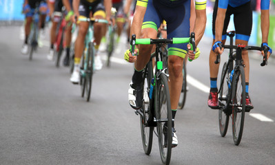 cyclists during the final sprint to win the stage of the cycling