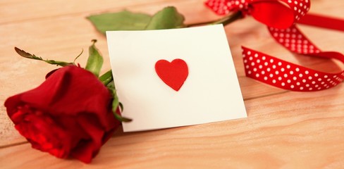 red rose and a red heart envelope