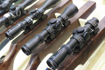 Stand with hunting rifles with telescopic sights. Weapon