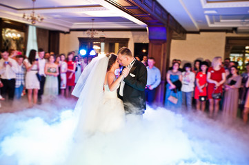 Amazing first wedding dance of wedding couple with heavy smoke a