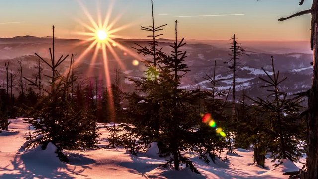 Time-lapse of a winter panorama during the sunrise in the polish mountains.