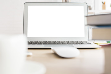 Wooden desktop with white laptop