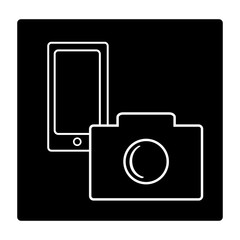 Mobile phone and camera on black background