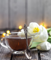 white tulips and a Cup of tea
