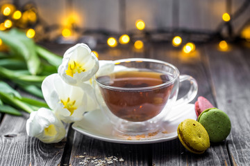 white tulips and a Cup of tea
