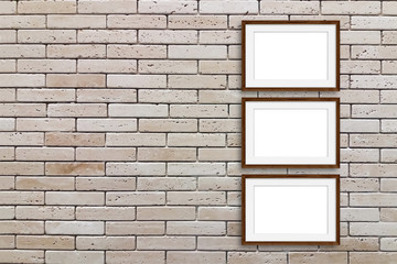 Obraz na płótnie Canvas Group of wooden frames on decorative bricks wall