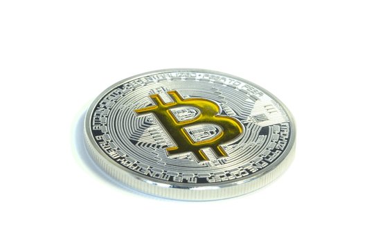 Single Bitcoin coin laying on white background