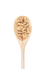Walnuts on wooden spoon. Top view.