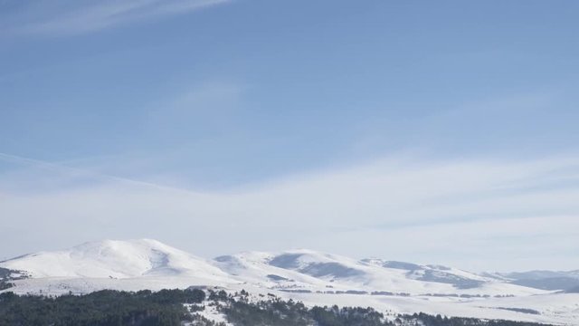 Tourist resort Zlatibor with snowed hills slow tilt 4K 2160p 30fps UltraHD footage - Western Serbia mountain region by winter 3840X2160 UHD tilting video 