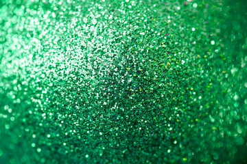 Closeup of green glittering christmas decoration ornaments, abstract background