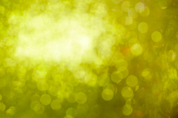 Obraz premium blurred closeup of yellow glittering christmas decoration ornaments, abstract background
