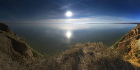 Landscape with a view of the sea estuary at sunset