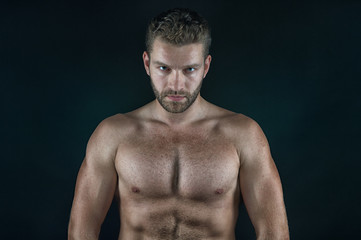 Fototapeta na wymiar handsome sexy man with muscular body and serious unshaven face
