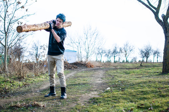 Young man and big log