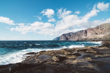 Fototapeta na wymiar View on rocky cliffs and ocean