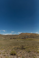 Clear blue sky over the abandoned gold rush town of Bodie, California