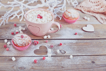 Tasty cupcake with berries and cup of coffee