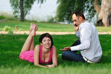 couple relaxing on the lawn