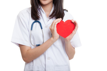 Close up of Asian female doctor hold a red heart and.