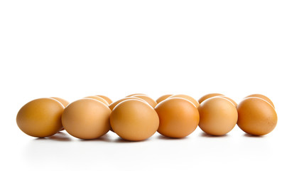 Raw eggs on white background