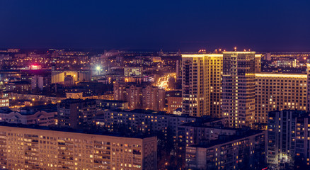 Fototapeta na wymiar Voronezh downtown. Night cityscape from rooftop. Modern houses, hotels, streets