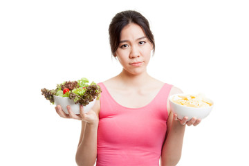 Beautiful Asian healthy girl salad and potato chips.