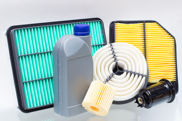 various automotive filters and a liter bottle of motor oil