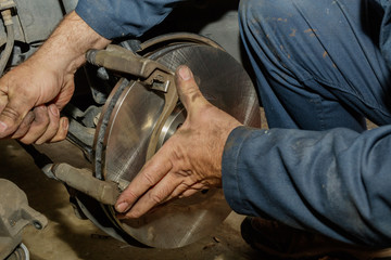 Reattaching front disk brake carrier to wheel assembly