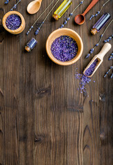 organic cosmetics with lavender on wooden background top view