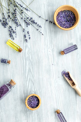 Fototapeta na wymiar organic cosmetics with lavender on wooden background top view