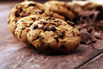 Chocolate cookies on wooden table. Chocolate chip cookies shot