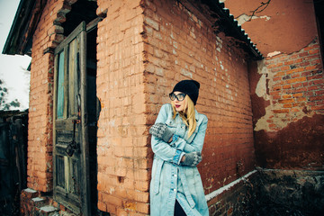 Fototapeta na wymiar Girl in a blue coat in winter