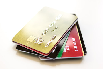 pile of credit cards on white background